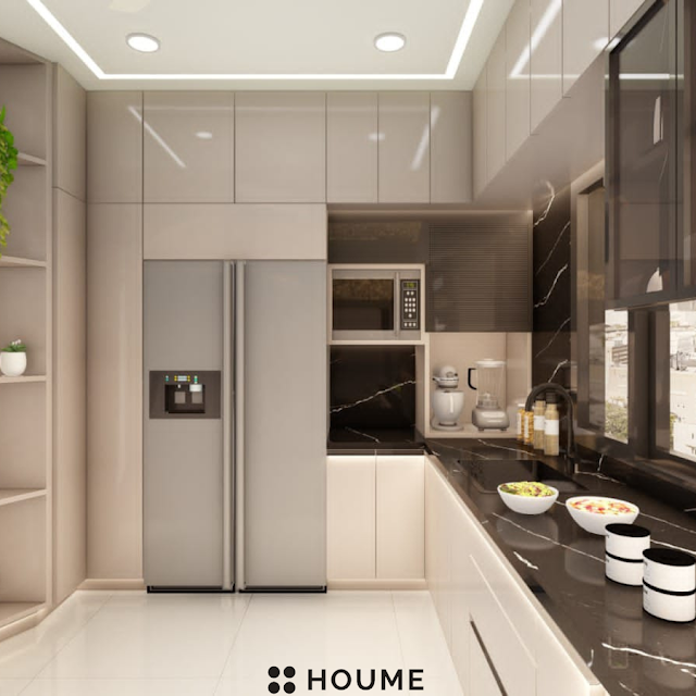 Modern kitchen with stainless steel appliances, light wood cabinets, and a ceiling fan. Text overlay: Houme India - Kitchen Design Ideas. D