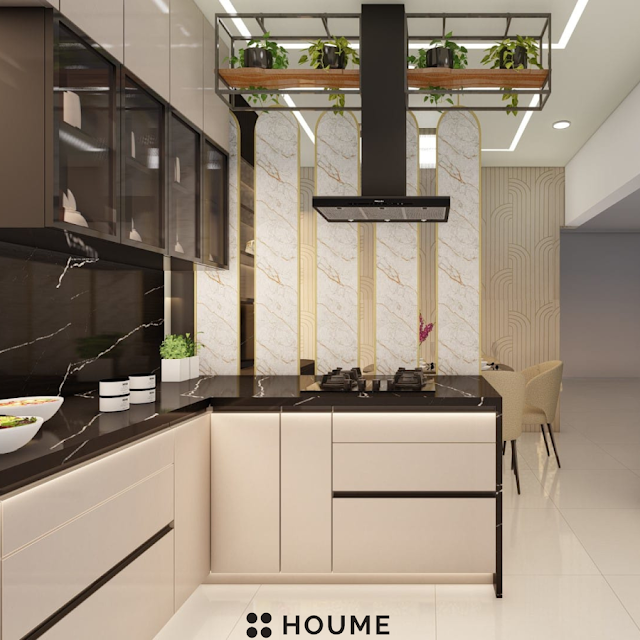 Modern kitchen with stainless steel appliances, light wood cabinets, and a ceiling fan. Text overlay: Houme India - Kitchen Design Ideas. C