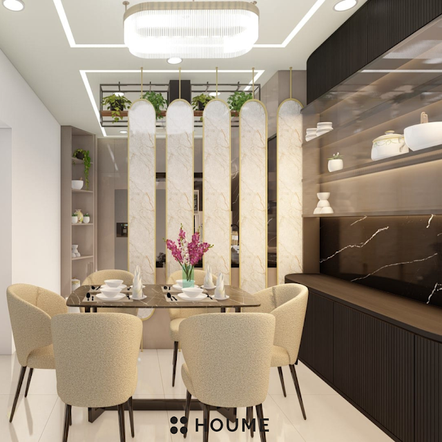 Modern kitchen with stainless steel appliances, light wood cabinets, and a ceiling fan. Text overlay: Houme India - Kitchen Design Ideas. E