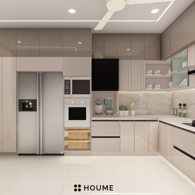 Modern kitchen with a black stainless steel stovetop, oven, and vent hood, light wood cabinets, and white quartz countertops. A ceiling fan with woven blades hangs from the vaulted ceiling with exposed wooden beams. Text overlay: Houme India - Kitchen Design Ideas. B