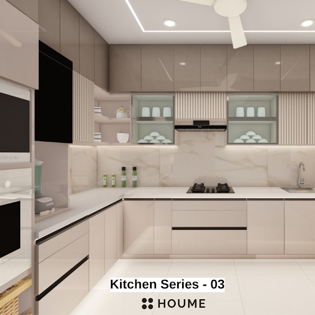 Modern kitchen with a black stainless steel stovetop, oven, and vent hood, light wood cabinets, and white quartz countertops. A ceiling fan with woven blades hangs from the vaulted ceiling with exposed wooden beams. Text overlay: Houme India - Kitchen Design Ideas.