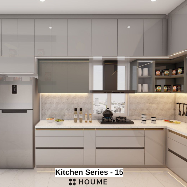 Modern kitchen with a sleek black vent hood over a stainless steel stovetop and built-in oven, light wood cabinets, and white quartz countertops. Text overlay: Houme India - Kitchen Design Ideas.