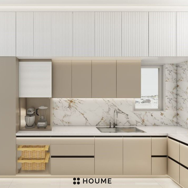 Modern kitchen with open wood shelves, butcher block breakfast bar with stools, stainless steel sink, and a window with a black frame overlooking a green backyard. Text overlay: Houme India - Kitchen Design Ideas. B
