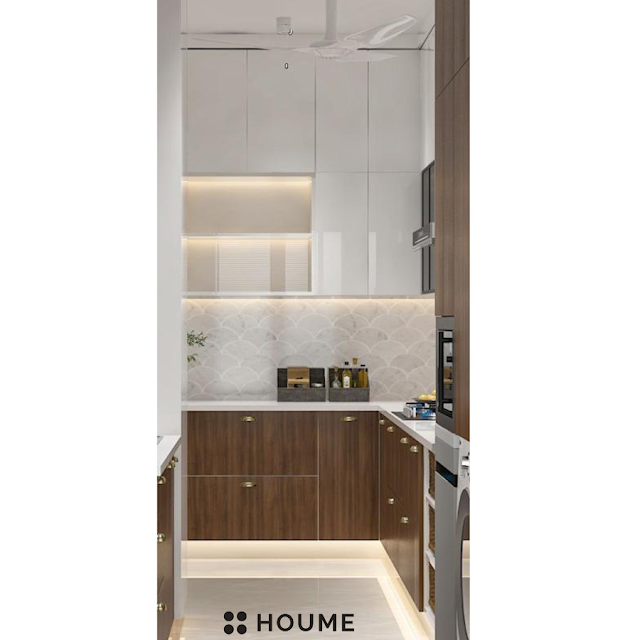 Traditional Indian kitchen with patterned tile flooring, wooden cabinets in a warm brown tone, and a vintage ceiling fan with woven blades. Text overlay: Houme India - Kitchen Design Ideas. E