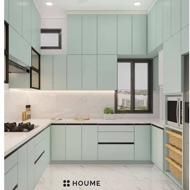 Modern kitchen featuring white cabinets with gold hardware, a black quartz countertop, and a stainless steel sink with a faucet. Text overlay: Houme India - Kitchen Design Ideas. C