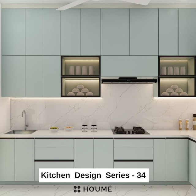 Modern kitchen featuring white cabinets with gold hardware, a black quartz countertop, and a stainless steel sink with a faucet. Text overlay: Houme India - Kitchen Design Ideas.