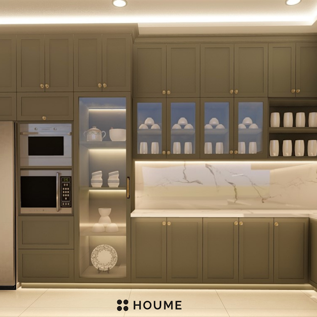 Modern kitchen with white cabinets, stainless steel appliances, and a spacious walk-in pantry featuring floor-to-ceiling glass doors. Text overlay: Houme India - Kitchen Design Ideas. C