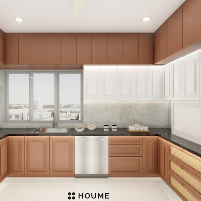 Kitchen with vaulted ceiling featuring exposed wooden beams and a large arched window with a black metal frame. The kitchen has white cabinets, a farmhouse sink with a vintage faucet, and a black pendant lamp. Text overlay: Houme India - Kitchen Design Ideas. C