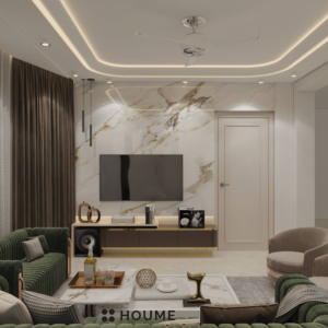 Living room with a green velvet sofa, a round brass coffee table with a marble top, and a woven jute rug. Text overlay: Houme India - Interior Design Ideas. B