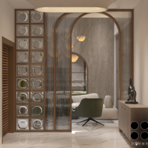 Living room with a modern gray couch, round wood coffee table with black metal legs, and a woven jute rug. Text overlay: Houme India - Interior Design Ideas. D