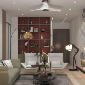 Modern living room with a large flat screen TV mounted on a white wall above a wooden media console. A light gray fabric sofa sits on a woven jute rug in the center of the space. Text overlay: Houme India - Interior Design Ideas. C