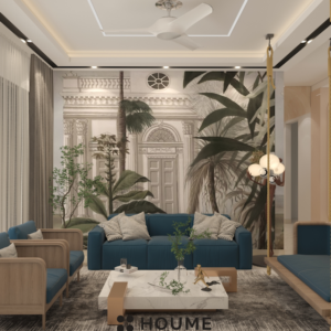 Modern living room with a large flat screen TV mounted on a white wall, a gray fabric sofa with a wooden coffee table and a woven jute rug. Text overlay: Houme India - Interior Design Ideas. C