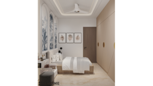 Bedroom interior featuring a tropical mural on the accent wall. The mural depicts a variety of plants and flowers, including palm trees, monstera leaves, and birds of paradise. A white bed with a woven cream blanket and pillows sits in front of the mural. Text overlay: Houme India - Interior Design Ideas. B