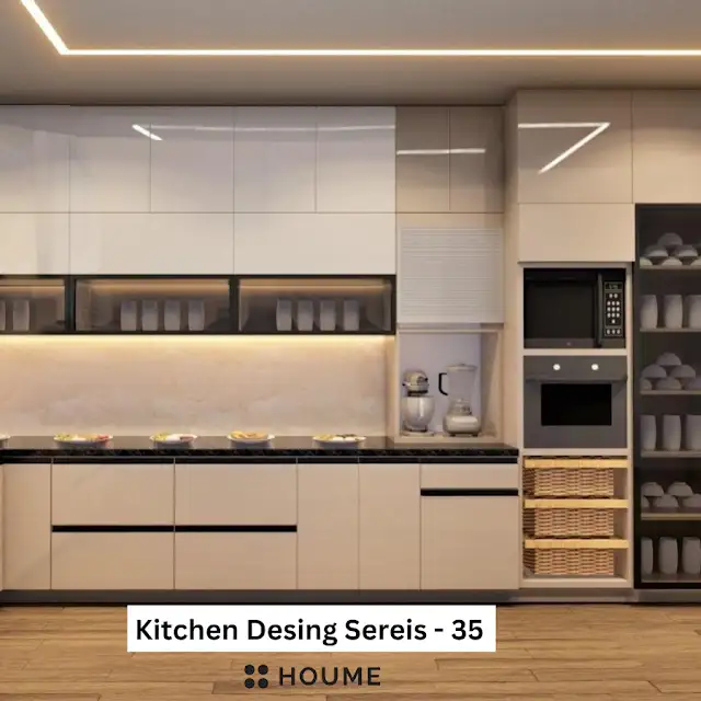 Modern kitchen interior featuring white cabinets with chrome hardware and a built-in microwave oven above the counter. A stainless steel sink and faucet are visible in the foreground. Text overlay: Houme India - Interior Design Ideas.