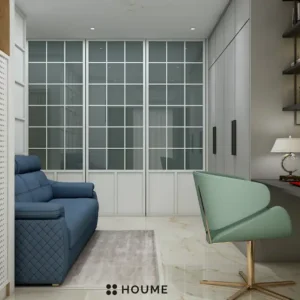 Simple, clean bathroom interior in a 3D rendering. The bathroom features a white toilet, pedestal sink with a chrome faucet, and a rectangular mirror with a chrome frame above the sink. The walls are a light beige color, and a window with frosted glass on the right wall allows for natural light. Text overlay: Houme India - Interior Design Ideas. B