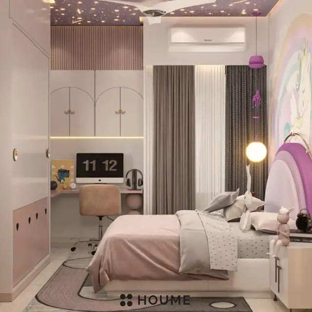 Mid-century modern bedroom interior featuring a platform bed with a walnut wood frame, a woven cream blanket and pillows, and a round wooden nightstand with a drawer. A woven jute rug covers the floor. A ceiling fan with woven blades hangs from the ceiling. The wall behind the bed is painted a light blue color. Text overlay: Houme India - Interior Design Ideas. B