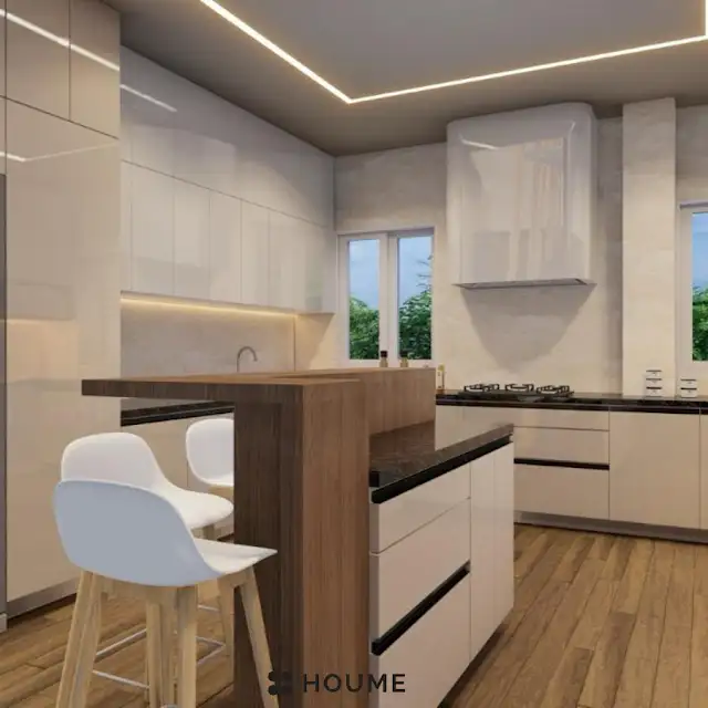 Modern kitchen interior featuring white cabinets with chrome hardware and a built-in microwave oven above the counter. A stainless steel sink and faucet are visible in the foreground. Text overlay: Houme India - Interior Design Ideas. C