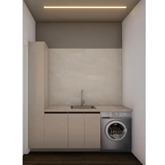 Modern kitchen interior featuring white cabinets with chrome hardware and a built-in microwave oven above the counter. A stainless steel sink and faucet are visible in the foreground. Text overlay: Houme India - Interior Design Ideas. D