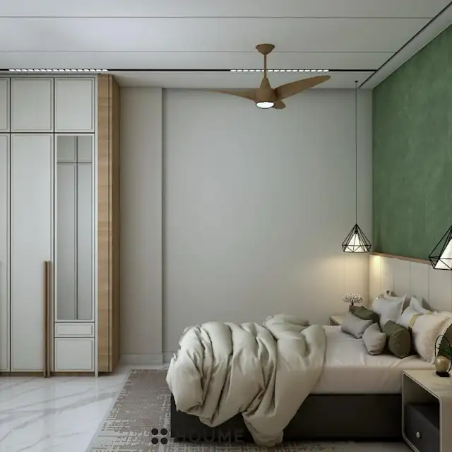 Mid-century modern bedroom featuring a platform bed with a walnut wood frame, a woven cream blanket and pillows, and a round wooden nightstand with a drawer. A woven jute rug covers the floor. A ceiling fan with woven blades hangs from the ceiling. Text overlay: Houme India - Interior Design Ideas. B