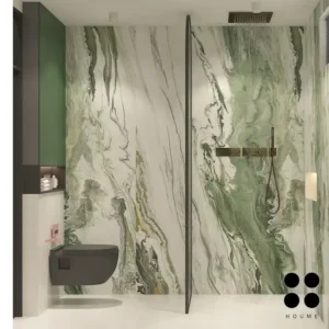 Modern bathroom interior featuring a freestanding bathtub positioned in the center of the room, with a large window behind it offering a view of a garden. The bathtub has a chrome faucet and sits on a white tile floor. Text overlay: Houme India - Interior Design Ideas. D
