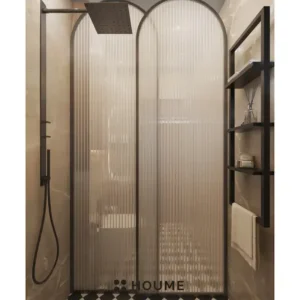 Simple, clean bathroom interior with a white toilet, pedestal sink with a chrome faucet, and a rectangular mirror with a chrome frame mounted above the sink. Text overlay: Houme India - Interior Design Ideas. B