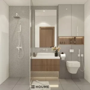 Simple bathroom interior featuring a white toilet, sink with a chrome faucet, and a rectangular mirror with a chrome frame above the sink. Text overlay: Houme India - Interior Design Ideas. B
