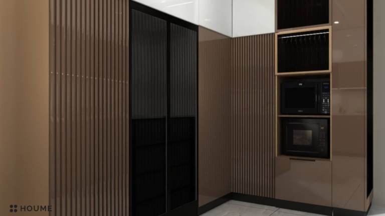 A photorealistic rendering of a modern kitchen design by Houme India. The kitchen features black and brown cabinets, a black refrigerator, and open shelving. The countertop is a light-colored marble, and the backsplash is a textured white tile. E