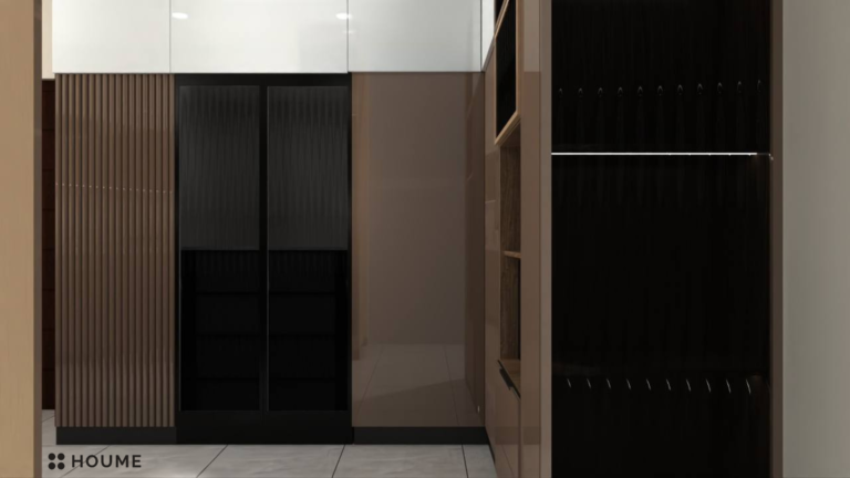 A photorealistic rendering of a modern kitchen design by Houme India. The kitchen features black and brown cabinets, a black refrigerator, and open shelving. The countertop is a light-colored marble, and the backsplash is a textured white tile. F