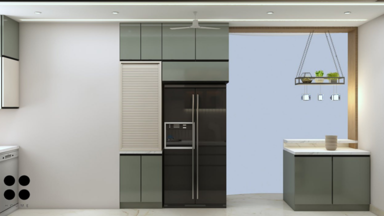 A photorealistic rendering of a modern kitchen design by Houme India. The kitchen features sage green cabinets with black trim, a sleek countertop, and glass-front cabinets. Integrated appliances and under-cabinet lighting complete the look. C