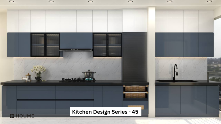 A photorealistic rendering of a modern kitchen design by Houme India. The kitchen features blue-grey and white cabinets with black accents, a sleek countertop, and glass cabinet doors with ribbed glass inserts.
