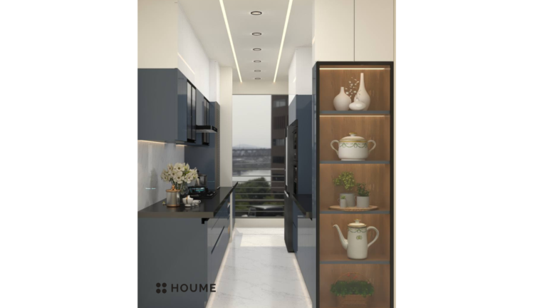 A photorealistic rendering of a modern kitchen design by Houme India. The kitchen features blue-grey and white cabinets with black accents, a sleek countertop, and glass cabinet doors with ribbed glass inserts. C
