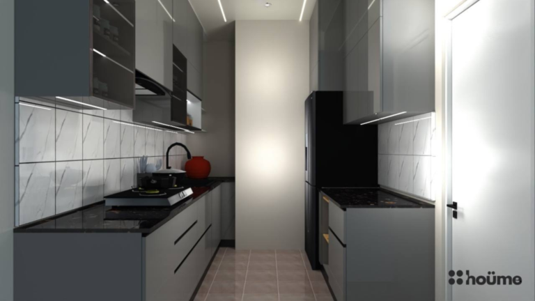 A modern grey kitchen with glossy cabinets, under-cabinet lighting, and a black countertop. C