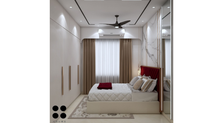 Modern master bedroom with a maroon velvet headboard, marble accent wall, and gold accents. B