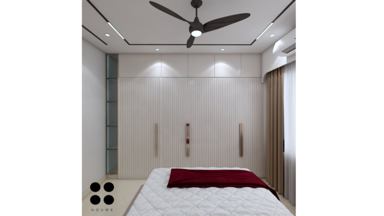 Modern master bedroom with a maroon velvet headboard, marble accent wall, and gold accents. D