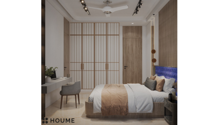 A modern bedroom with a large bed, nightstands on either side, and a dresser at the foot of the bed. The bed is made with white linens and has a fluffy comforter. There is a large window in the room with a view of the city skyline. C