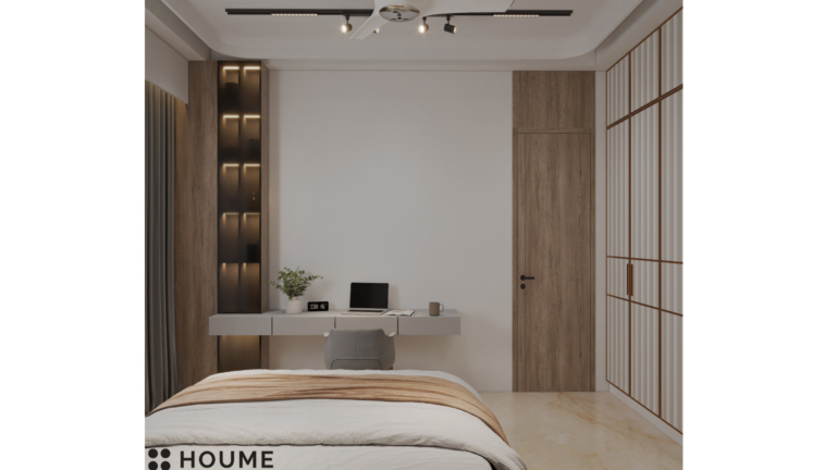 A modern bedroom with a large bed, nightstands on either side, and a dresser at the foot of the bed. The bed is made with white linens and has a fluffy comforter. There is a large window in the room with a view of the city skyline. D