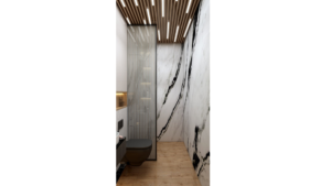 A modern washroom design with marble walls, a floating vanity, and recessed lighting. B