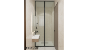 A modern washroom design with neutral toned tiles, a black framed glass shower enclosure, a floating black vanity, and recessed shelving. B