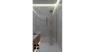 A modern washroom design featuring a large, rectangular mirror with integrated lighting, a freestanding bathtub, a vessel sink with a gold faucet, geometric patterned floor tiles, and a textured accent wall. D