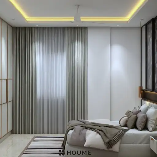 A modern and elegant parents' bedroom with a marble accent wall, a sleek platform bed, and warm accent lighting. C