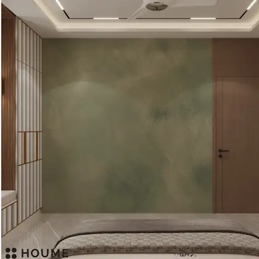 A modern bedroom design featuring a green upholstered bed, a textured stone accent wall, and pendant lighting D