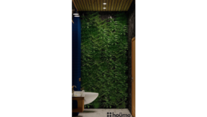 Modern washroom design with a blue arched door, marble walls, wood accents, and gold fixtures. C