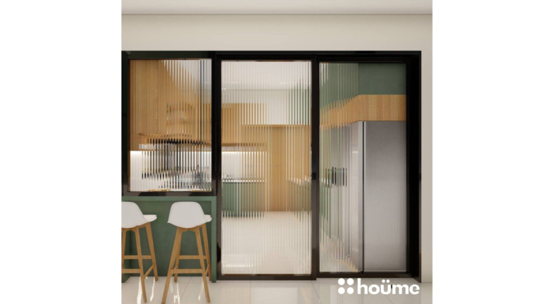 A modern L-shaped kitchen with light wood upper cabinets, sage green lower cabinets, and a breakfast bar. D