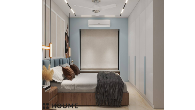 A modern master bedroom with a blue headboard, featuring artwork of cranes on the wall behind the bed C