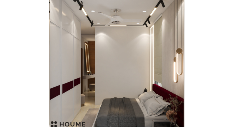 A modern master bedroom with a deep red headboard, pendant lights, and a mirrored accent wall. B