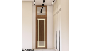 A digitally rendered image of a spacious walk-in closet featuring white wardrobes with long black handles and recessed lighting. C