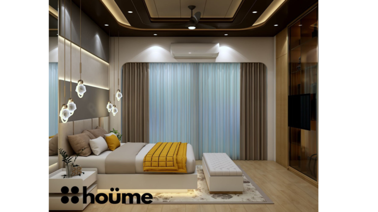 A modern master bedroom by Houme India with a dark recessed ceiling, a gray textured accent wall, and three modern pendant lights hanging above the bed. C