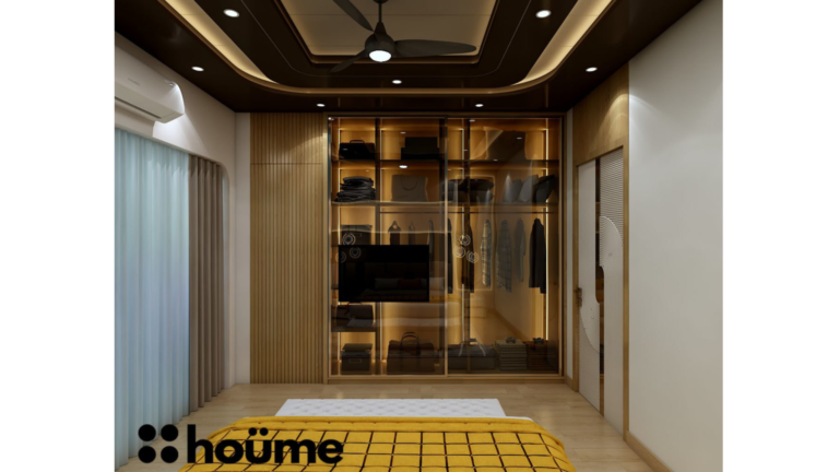 A modern master bedroom by Houme India with a dark recessed ceiling, a gray textured accent wall, and three modern pendant lights hanging above the bed. D