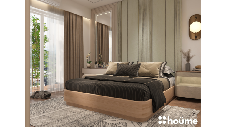 A modern master bedroom by Houme India featuring a light green textured accent wall, a unique pendant light fixture, and a wooden bed frame. B