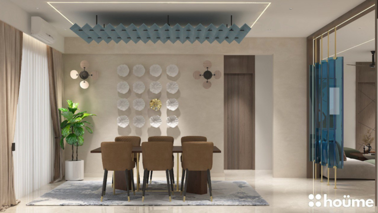 A contemporary living room design featuring a stylish blue glass partition separating the dining area, as showcased on Houme India's website. E